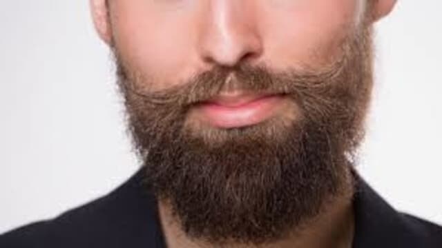 a man with beautiful mustache and beard transplant done at hairfree and hairgrow clinic