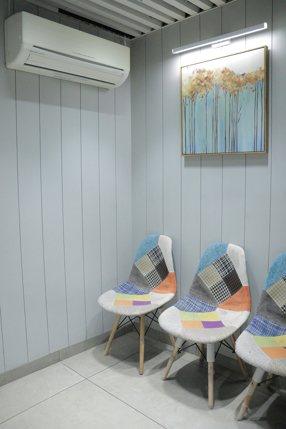 ac containing patient waiting area with three chair at hairfree hair grow mumbai clinic