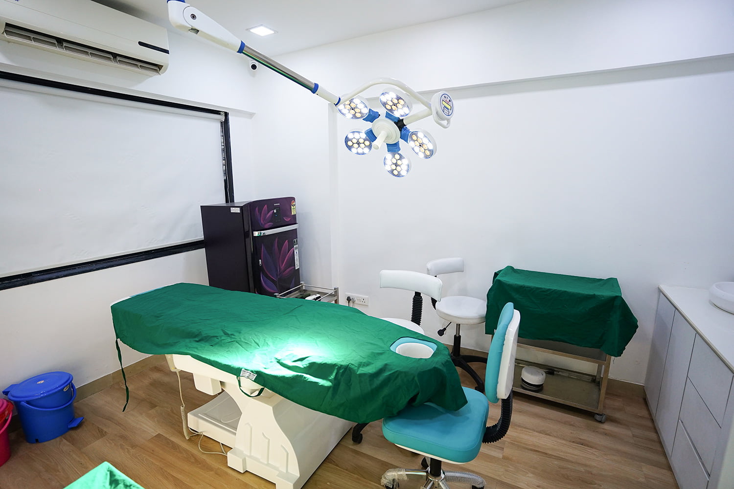 patient hair loss problem examination area with reclining table and light instruments at pune pimple gurav branch of hair free hair grow